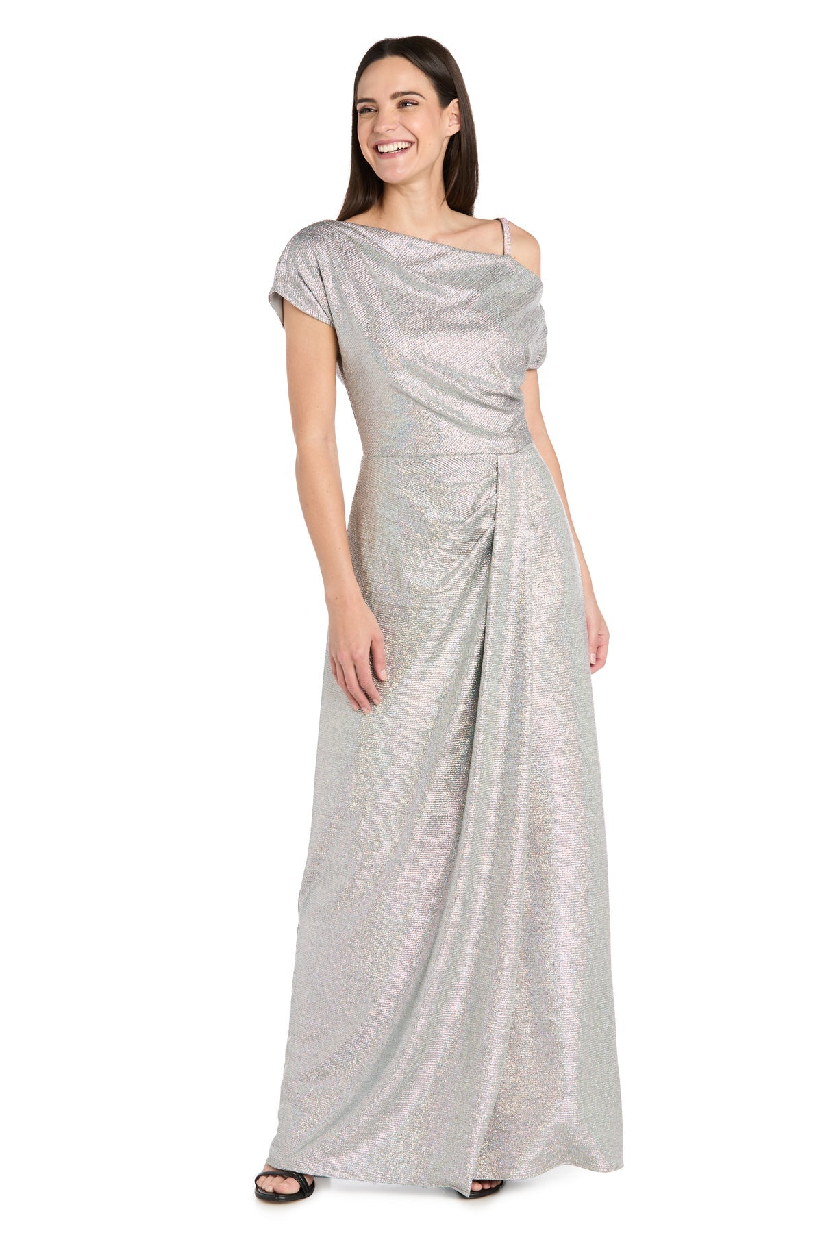 Woman wearing the R&M Richards 3758 Silver Metallic Formal Dress with one-shoulder draped detailing and black open-toe heels, standing and smiling.